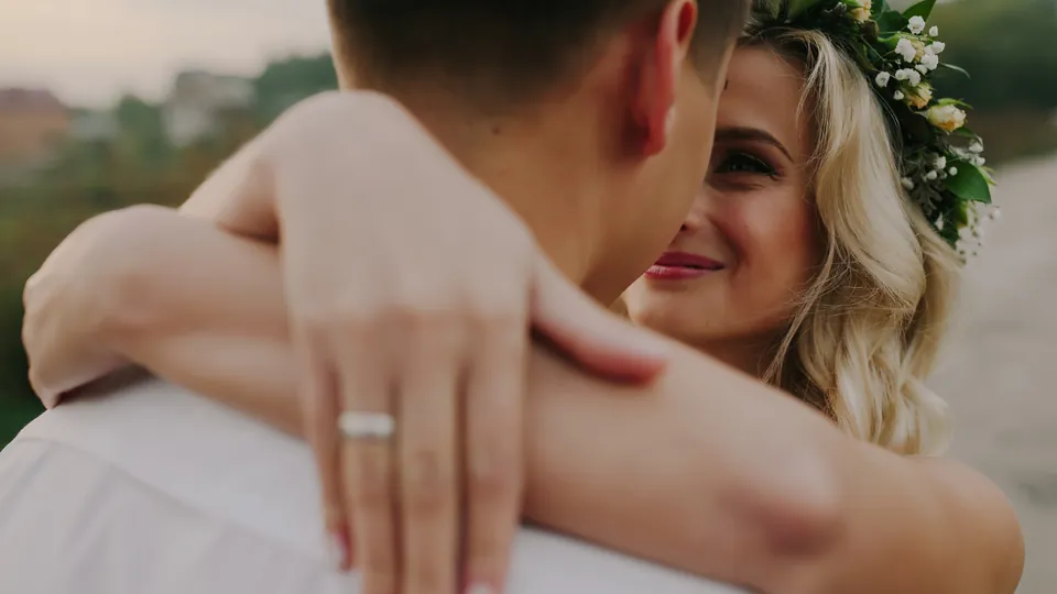 A bride and groom embracing